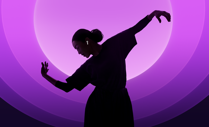 A person dancing while wearing AirPods 5, multi-colour background