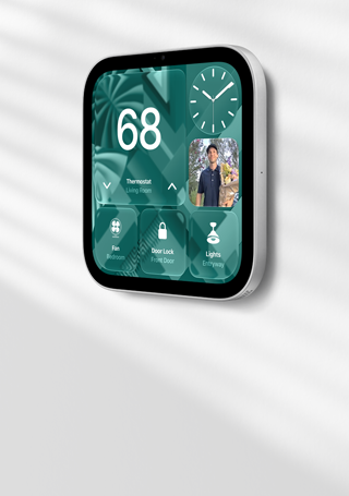Apple HomeView wall-mounted model on a wall, silver color, displaying time, temperature, and controls for thermostat, bedroom fan, door lock, and lights