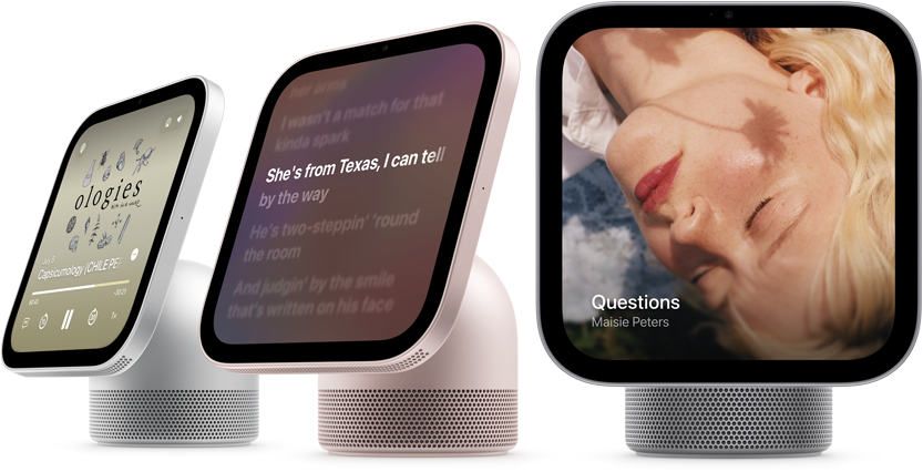 Apple HomeView, three devices all displaying Apple Music app album artwork and lyrics, from left to right, silver color, side exterior, rose pink color, side exterior, space gray color, front exterior