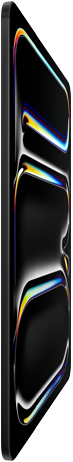 iPad Pro, front exterior, space black colour, aluminium and glass enclosure, thin profile, tilted back with display showing multicoloured line art