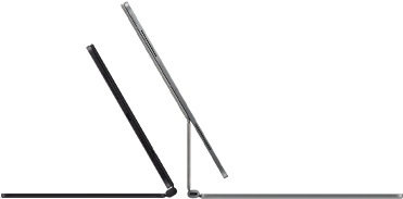 Two iPad Pro devices attached to Magic Keyboard, side exterior, thin profile, space black colour with speakers and USB-C port, tilted half open, silver colour, open, tilted back showing the keyboard’s floating cantilever design, speakers and microphone