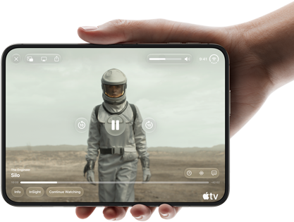iPhone Duo, held with one hand, opened in horizontal orientation, fully unfolded, interior screen displays Apple TV show “Silo”