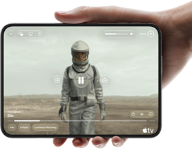 iPhone Duo, held with one hand, opened in horizontal orientation, fully unfolded, interior screen displays Apple TV show “Silo”