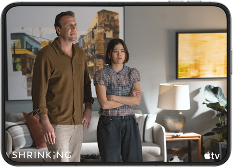 iPhone Duo, opened in horizontal position, Apple TV show “Shrinking” plays on screen