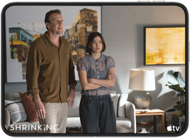 iPhone Duo, opened in horizontal position, Apple TV show “Shrinking” plays on screen