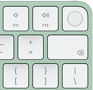 Magic Keyboard, top-right corner, green color, Touch ID , delete key, and volume function keys