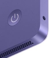 iMac, rear exterior, purple color, features: power button, headphone jack, and speaker grille