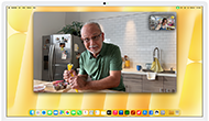 Desk View demonstration. Person on a video call watching top-down view of a baker decorating a cookie