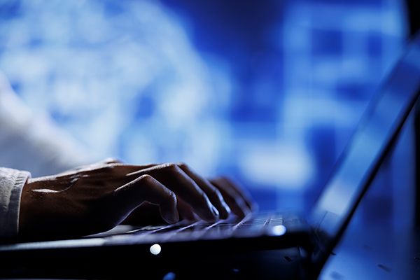 A professional IT relocation team carefully managing hardware equipment in a clean, brightly lit corporate office environment. The scene highlights precision, organization, and minimal disruption during a seamless business transition.