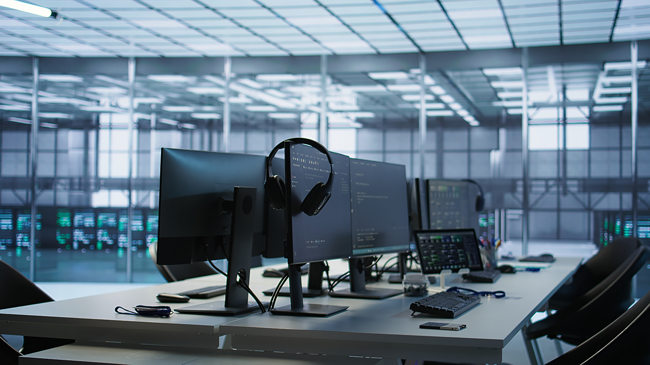 Professional office team working in a bright, modern minimalist workspace with high ceilings and natural light
