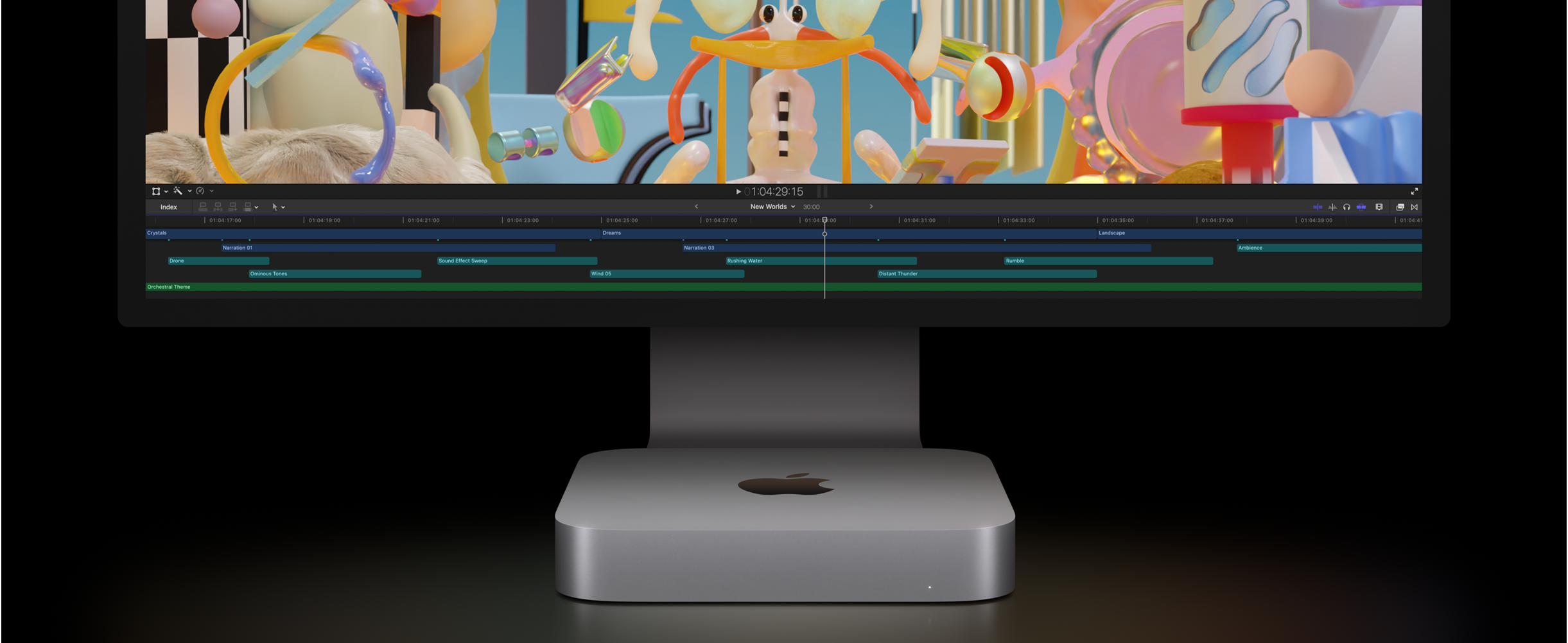 Front view of Mac mini and Studio Display showing a video-editing project in Final Cut Pro.
