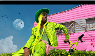 MacBook Air screen showing photo of person in colourful outfit, demonstrating colour range and resolution of Liquid Retina display