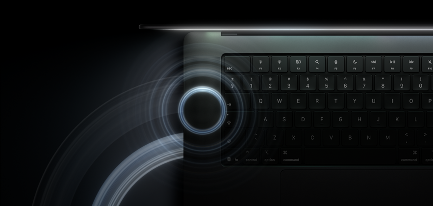 MacBook Pro with PROLED XDR Display, open lid, space black color, keyboard lit by glow from display, circles depicting sonic waves eminate from top and left side of laptop body