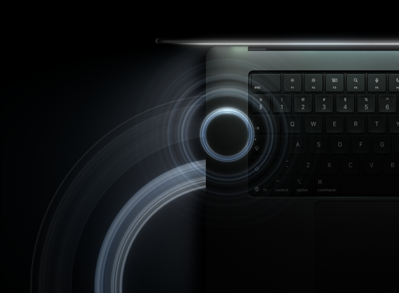 MacBook Pro with PROLED XDR Display, open lid, space black color, keyboard lit by glow from display, circles depicting sonic waves eminate from top and left side of laptop body