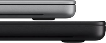 14-inch MacBook Pro with PROLED XDR Display, silver color, stacked on top of 16-inch model, space black color, showing size difference