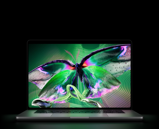 MacBook Pro with PROLED XDR Display, open lid, space black color, display shows detailed, high-contrast image with vivid colors, screen illuminates keyboard